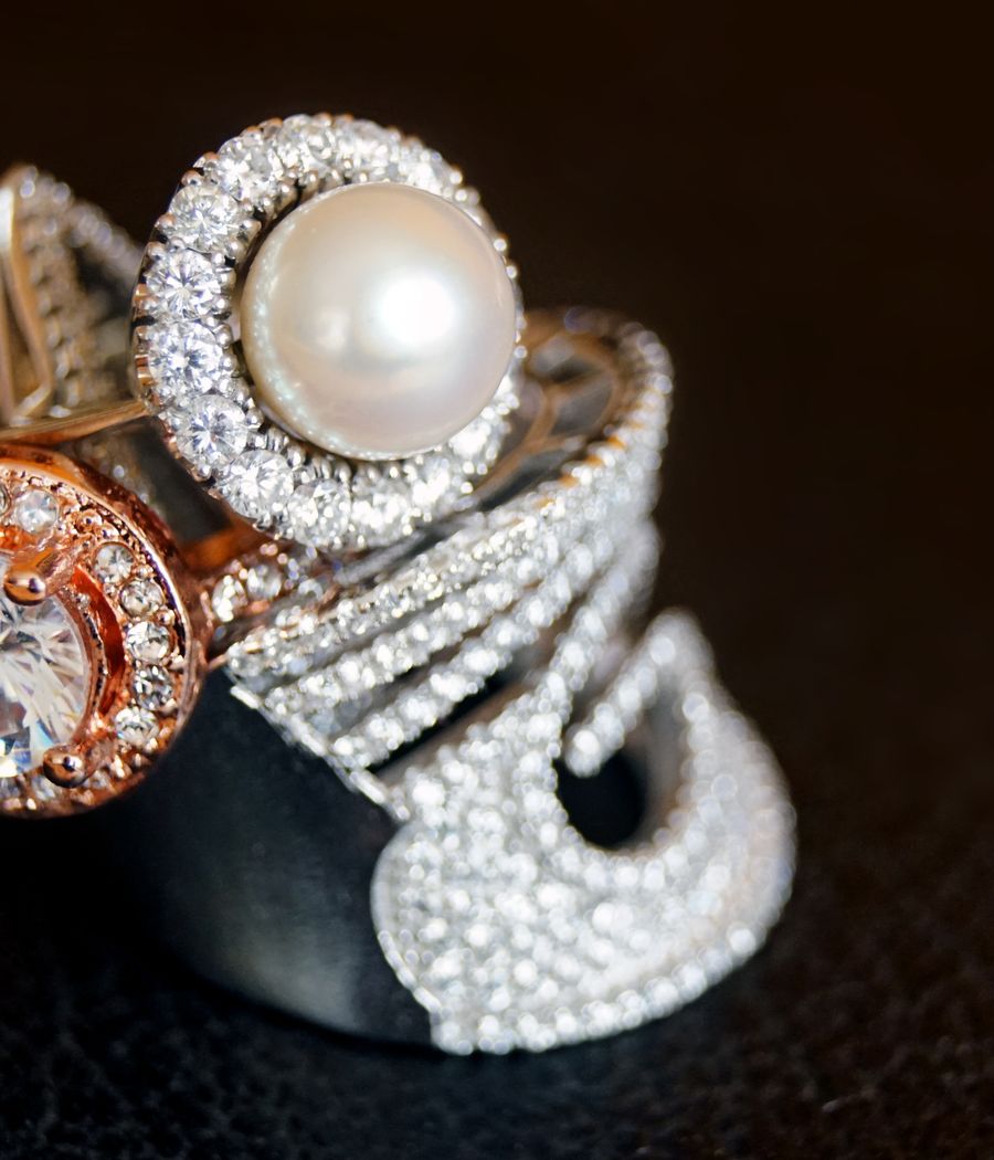 Statement diamond and pearl rings representing haute couture jewellery design